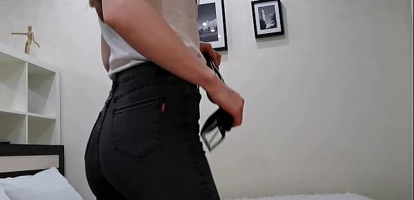  A girl in tight jeans took them off and spanked her ass on the redness with a leather belt